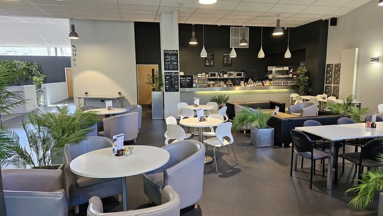 Modern Riverside Cafe seating, perfect for informal meetings and networking events.