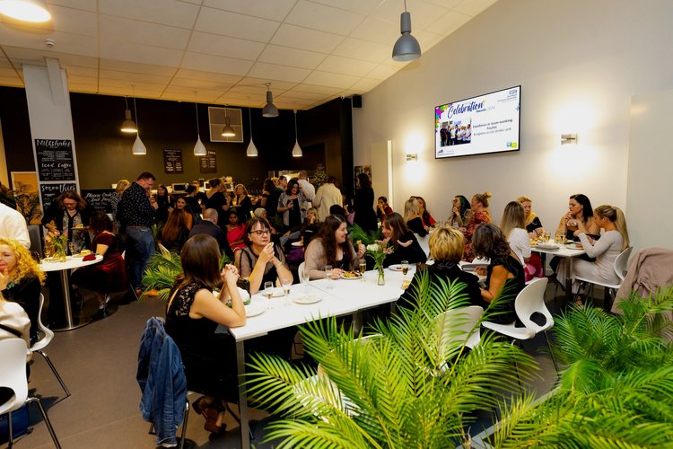 Riverside Cafe networking event with modern décor, promoting professional connections.