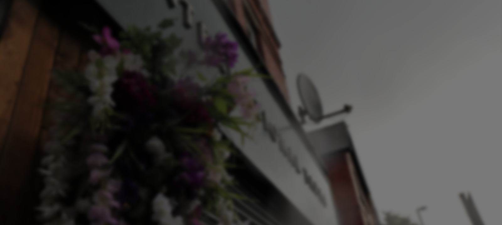 Eden Café Bistro event space entrance, floral decor, perfect for stylish gatherings.