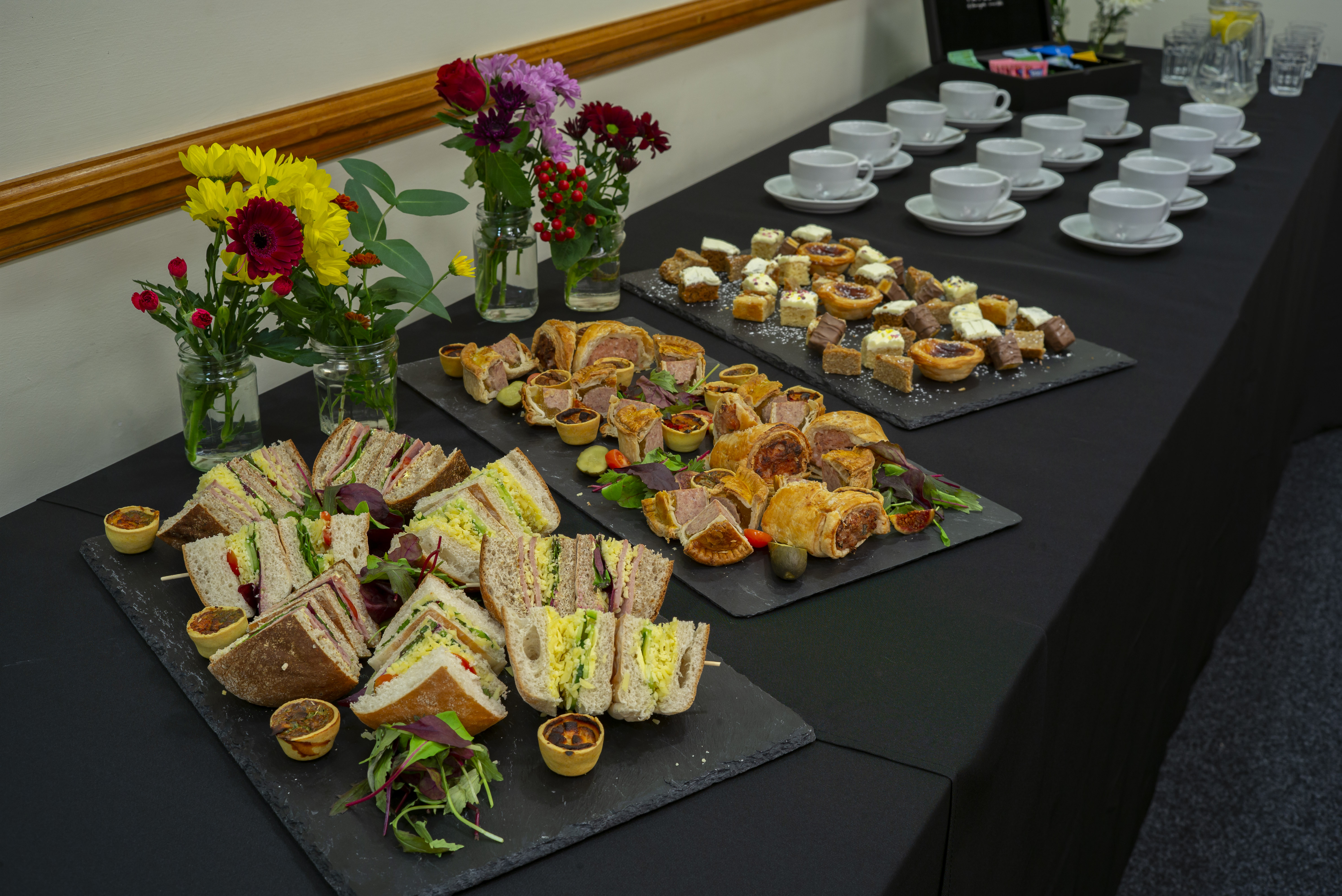Caphouse Suite catering setup with sandwiches and pastries for events at the National Coal Mining Museum.