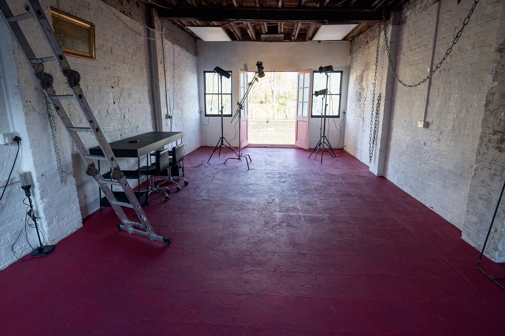 Spacious Victorian Industrial warehouse with a red floor ideal for meetings and workshops.
