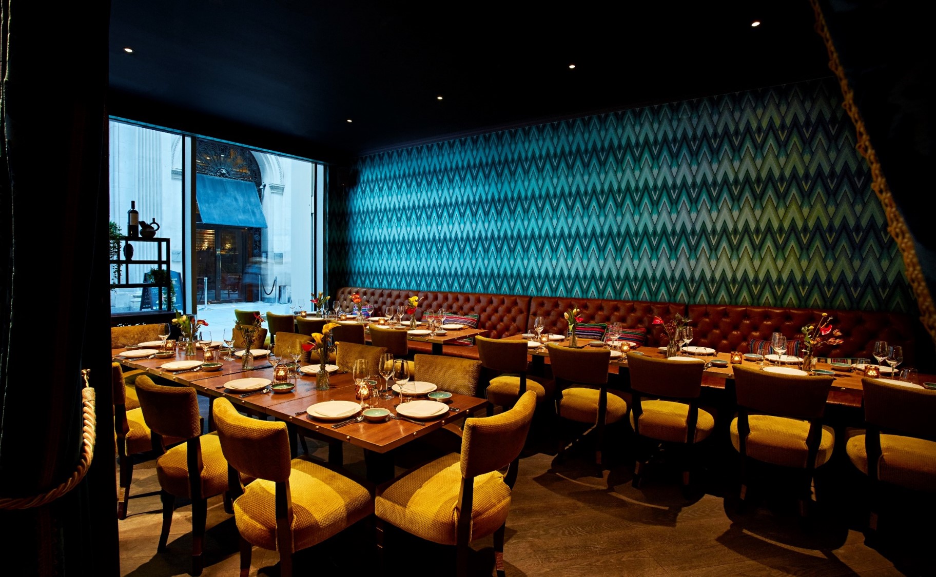 Inti Room in Coya City: modern dining space for corporate meetings, featuring warm decor.