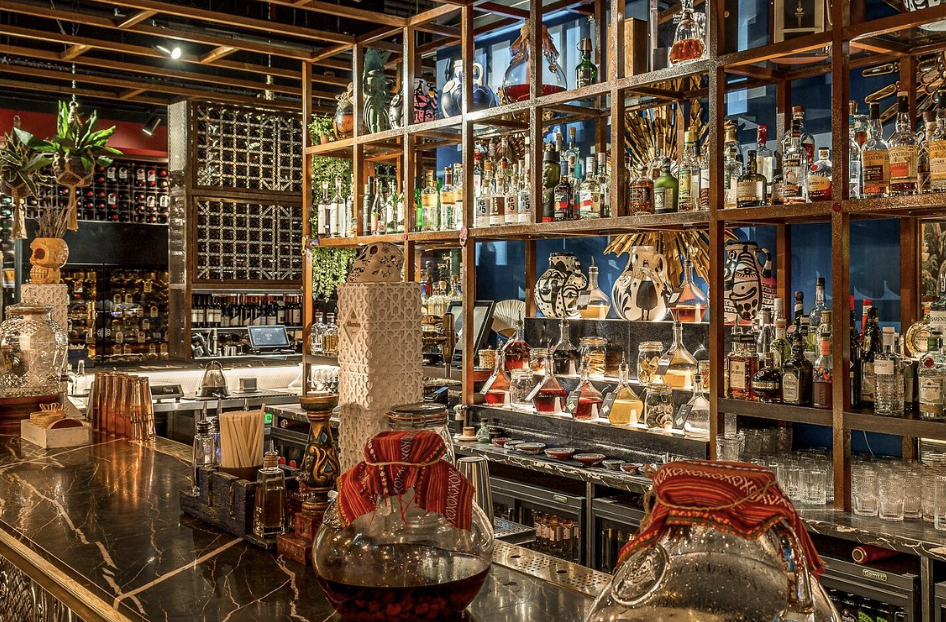 Stylish bar at Inti Room, Coya City; perfect for networking events and gatherings.