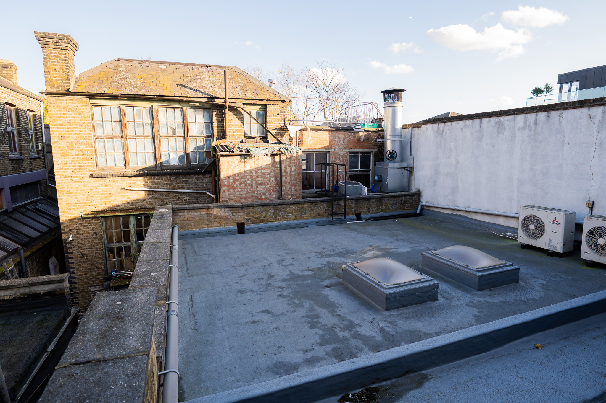 Concrete rooftop venue for outdoor events in Ingrid Kraftchenko Studios.