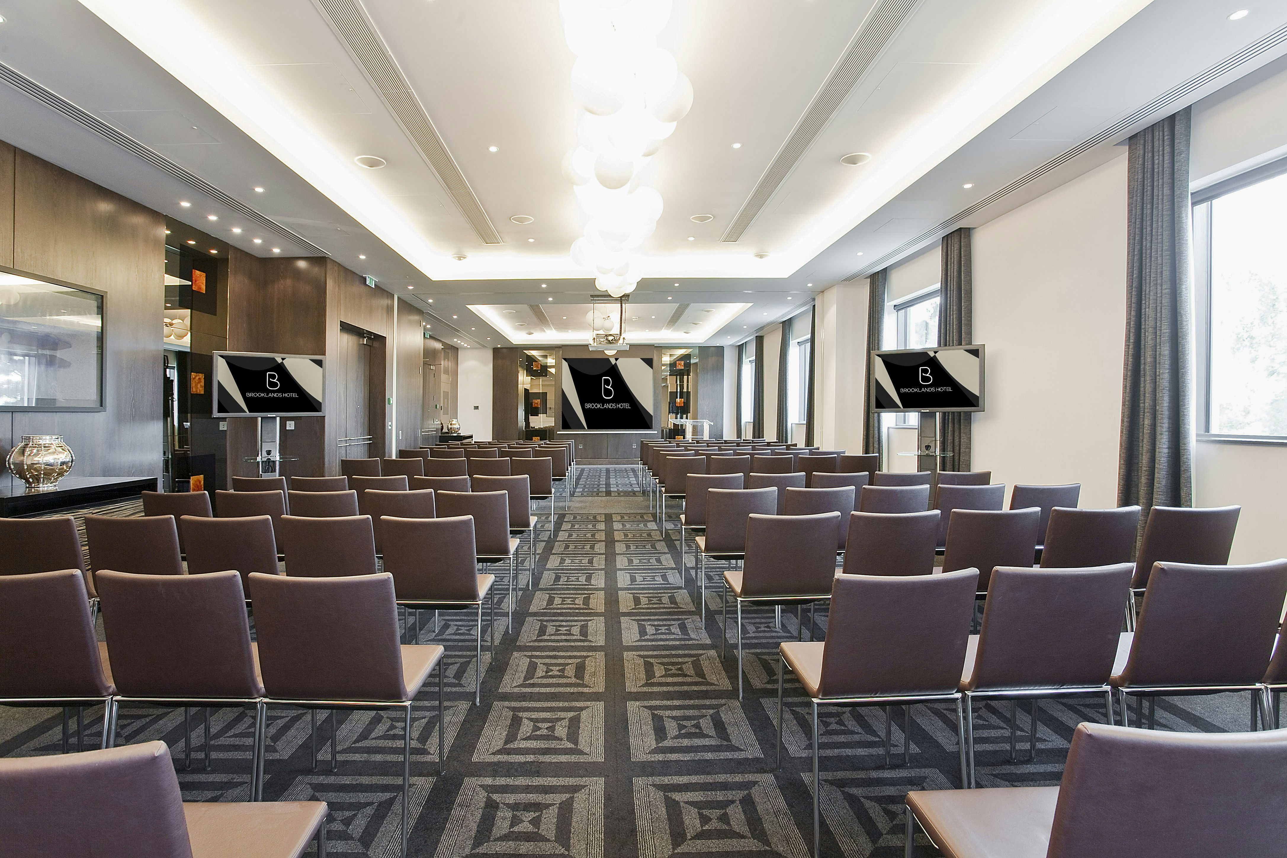 Modern conference room at Brooklands Hotel, ideal for meetings and presentations.