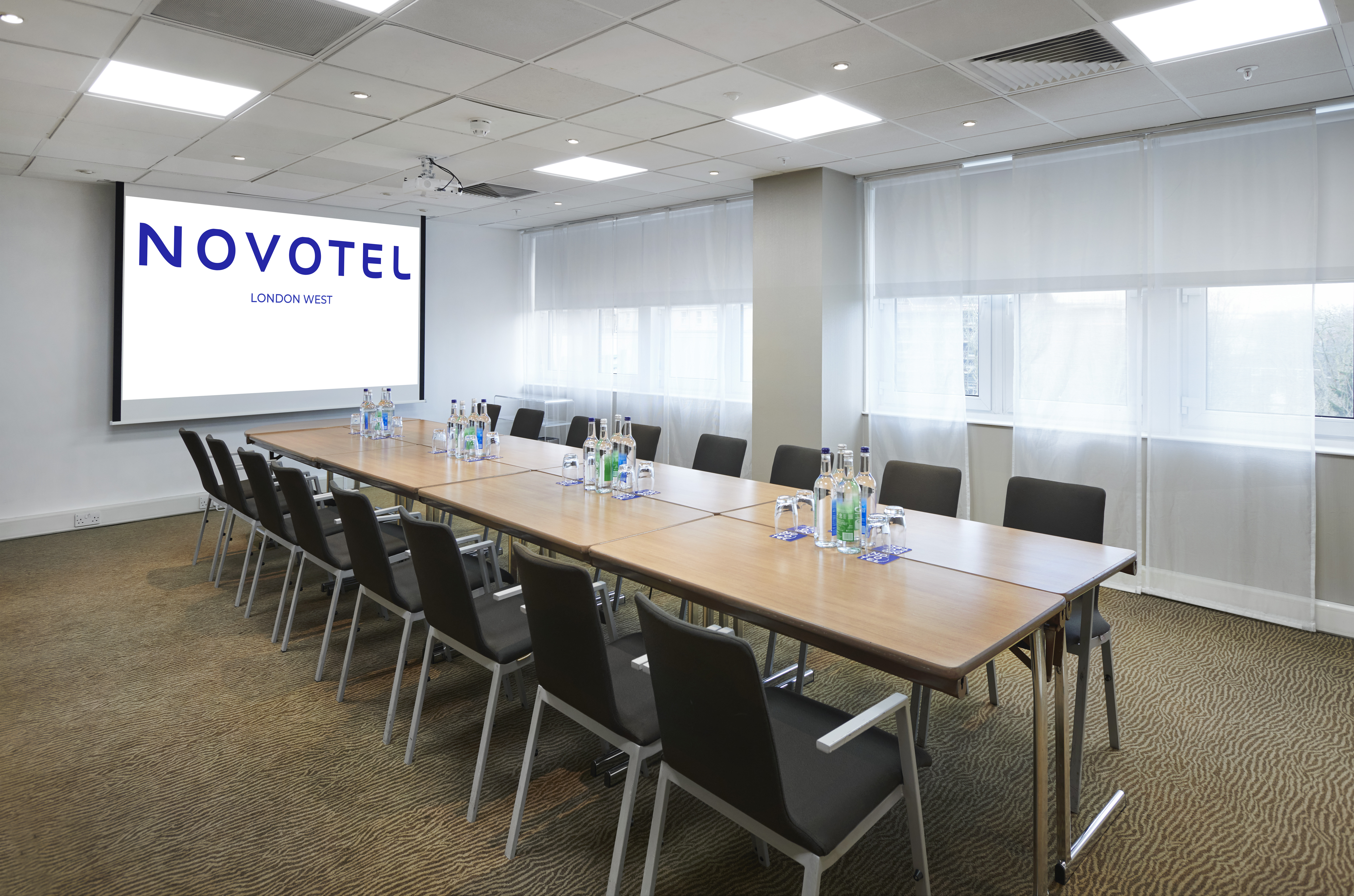 Barsac meeting room at Novotel London West, spacious with ergonomic chairs for corporate events.