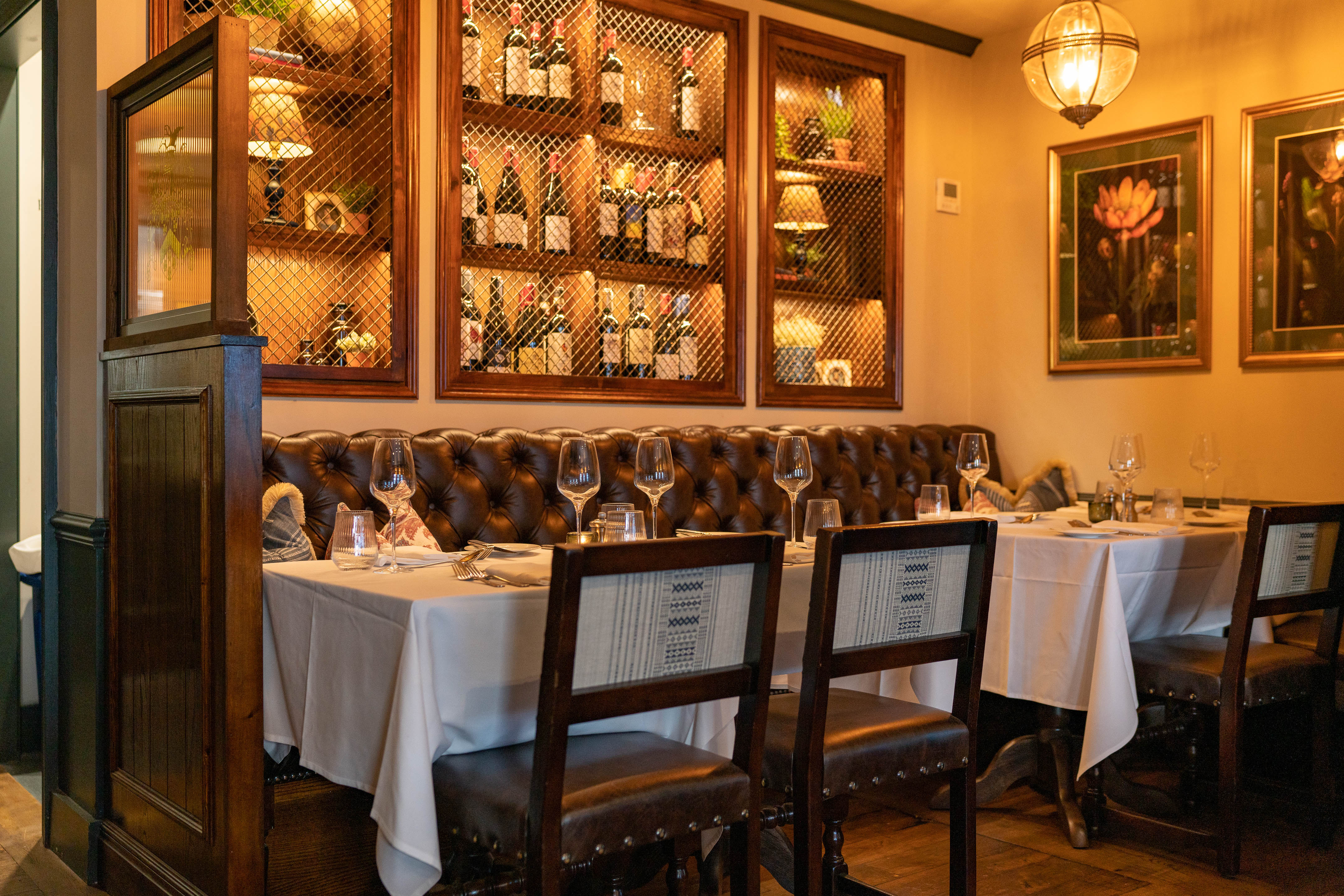 Elegant dining room with plush booths, ideal for intimate meetings and special events.