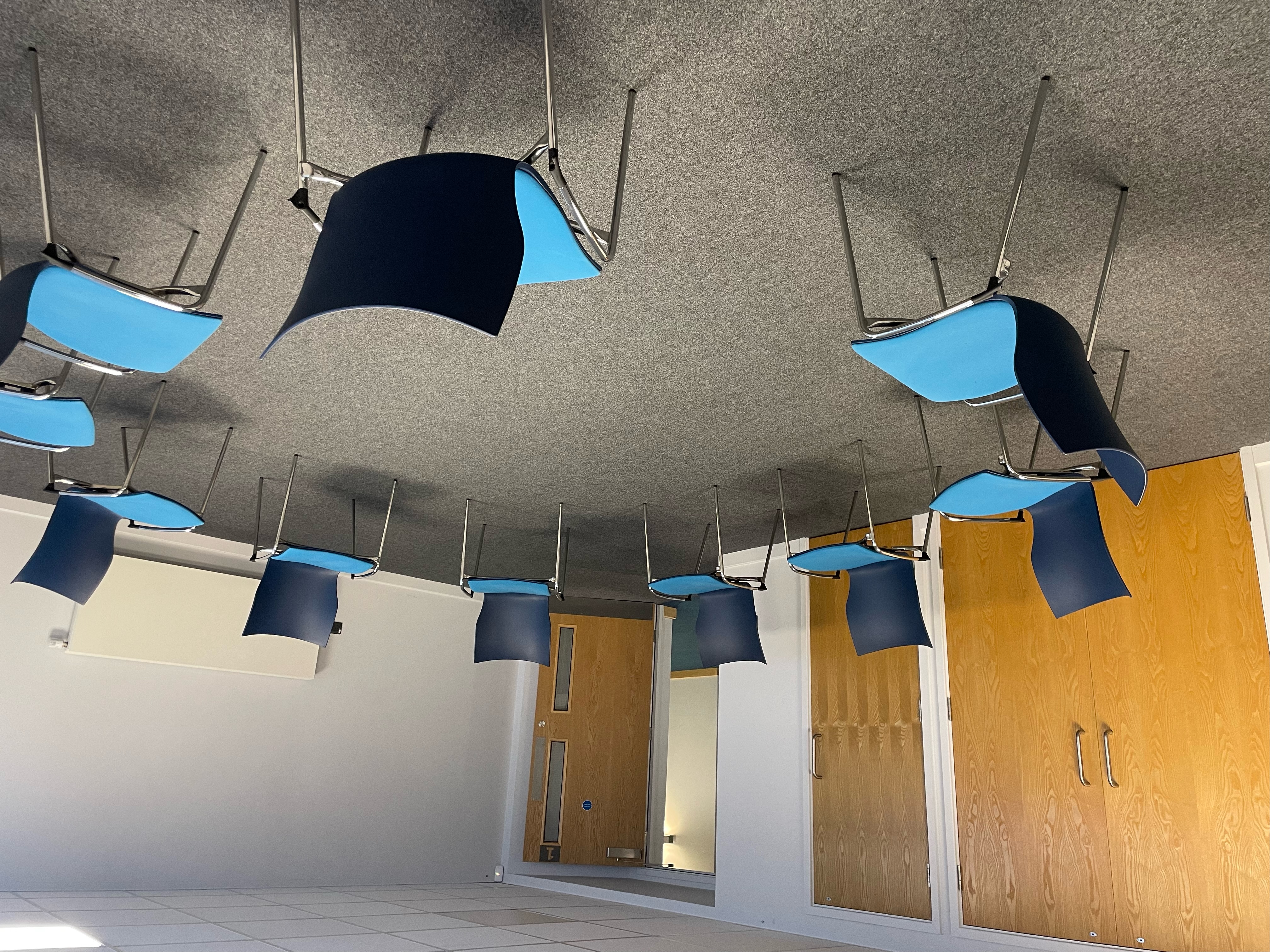 Circular chair arrangement in Riverside Conferencing Room for collaborative meetings.