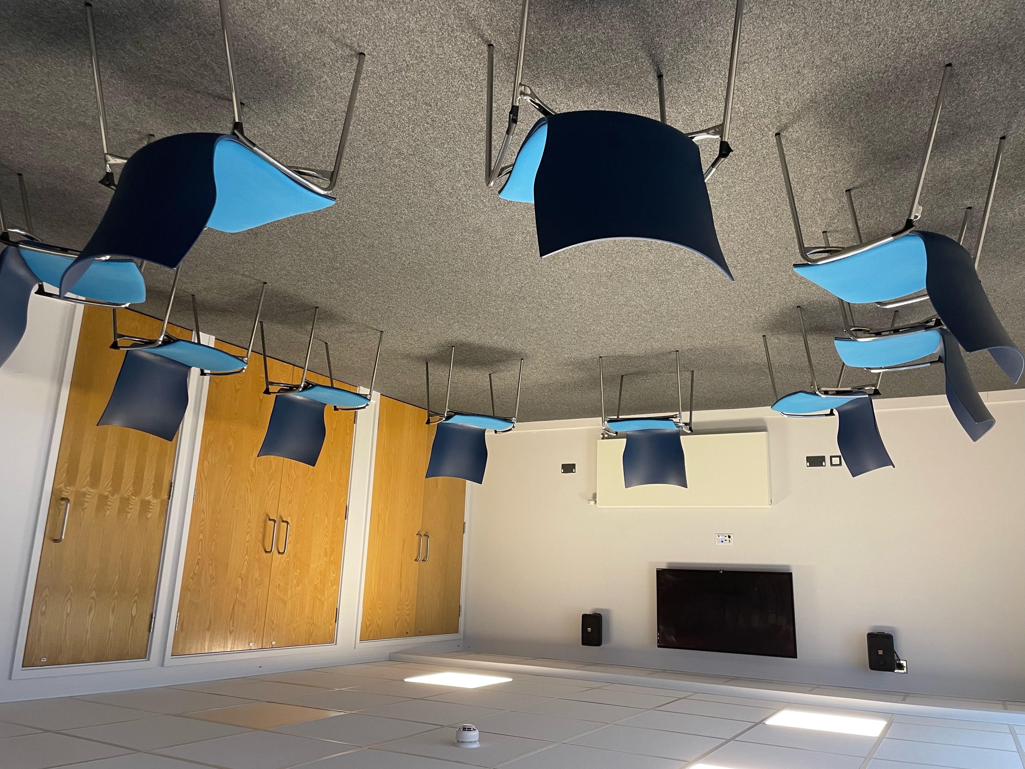 Versatile conference room with circular seating for interactive workshops and training events.