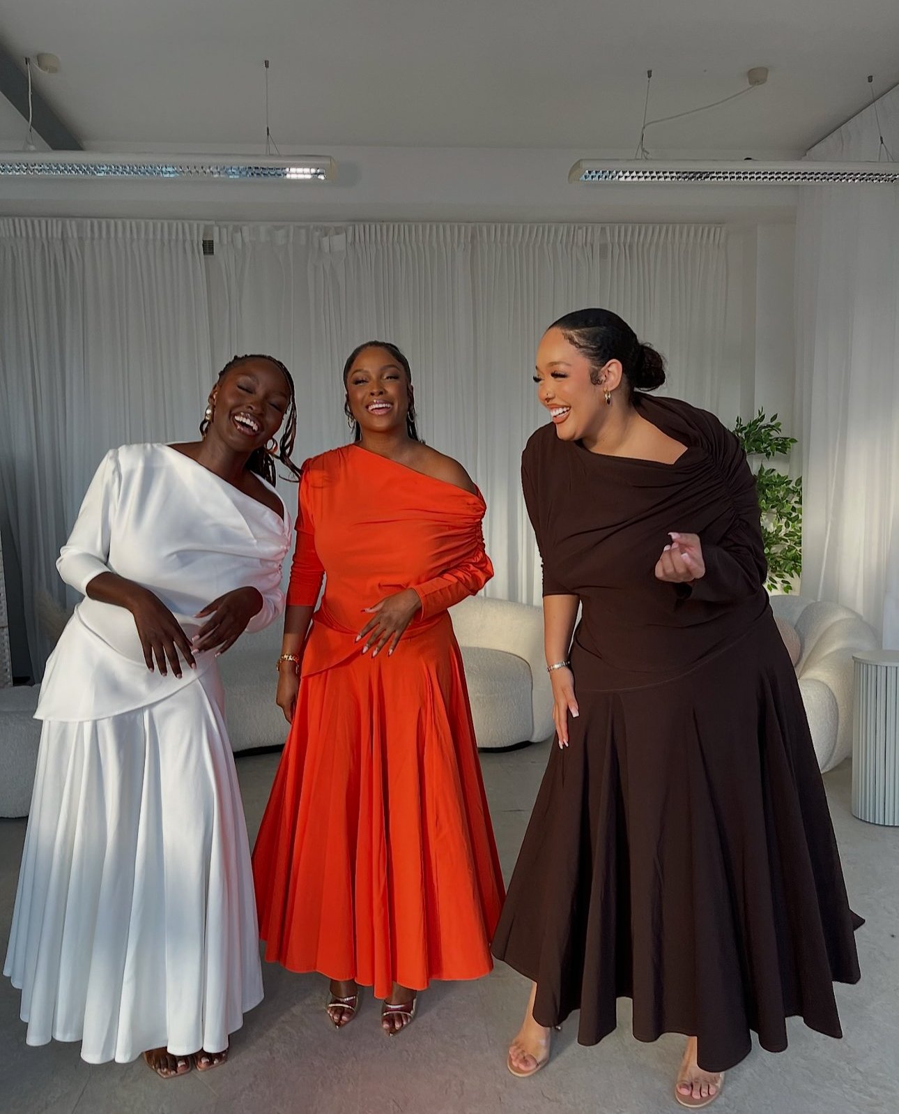 Elegant women networking in a modern event space at Creative Content Studio.