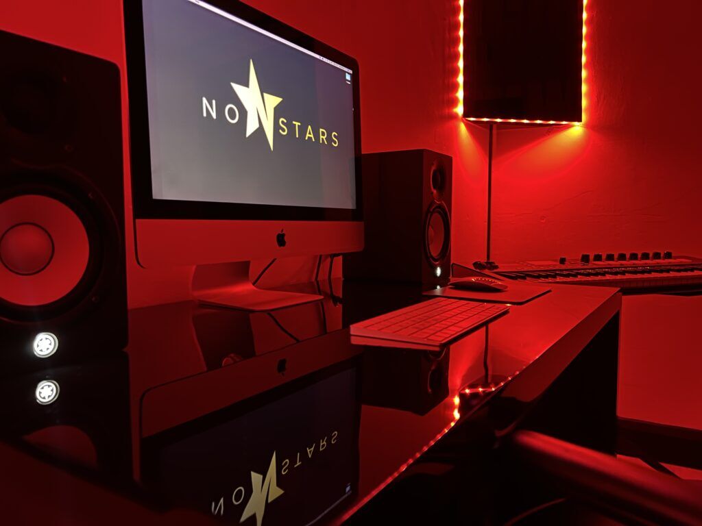 Sleek black workspace with vibrant red lighting for creative meetings and events.