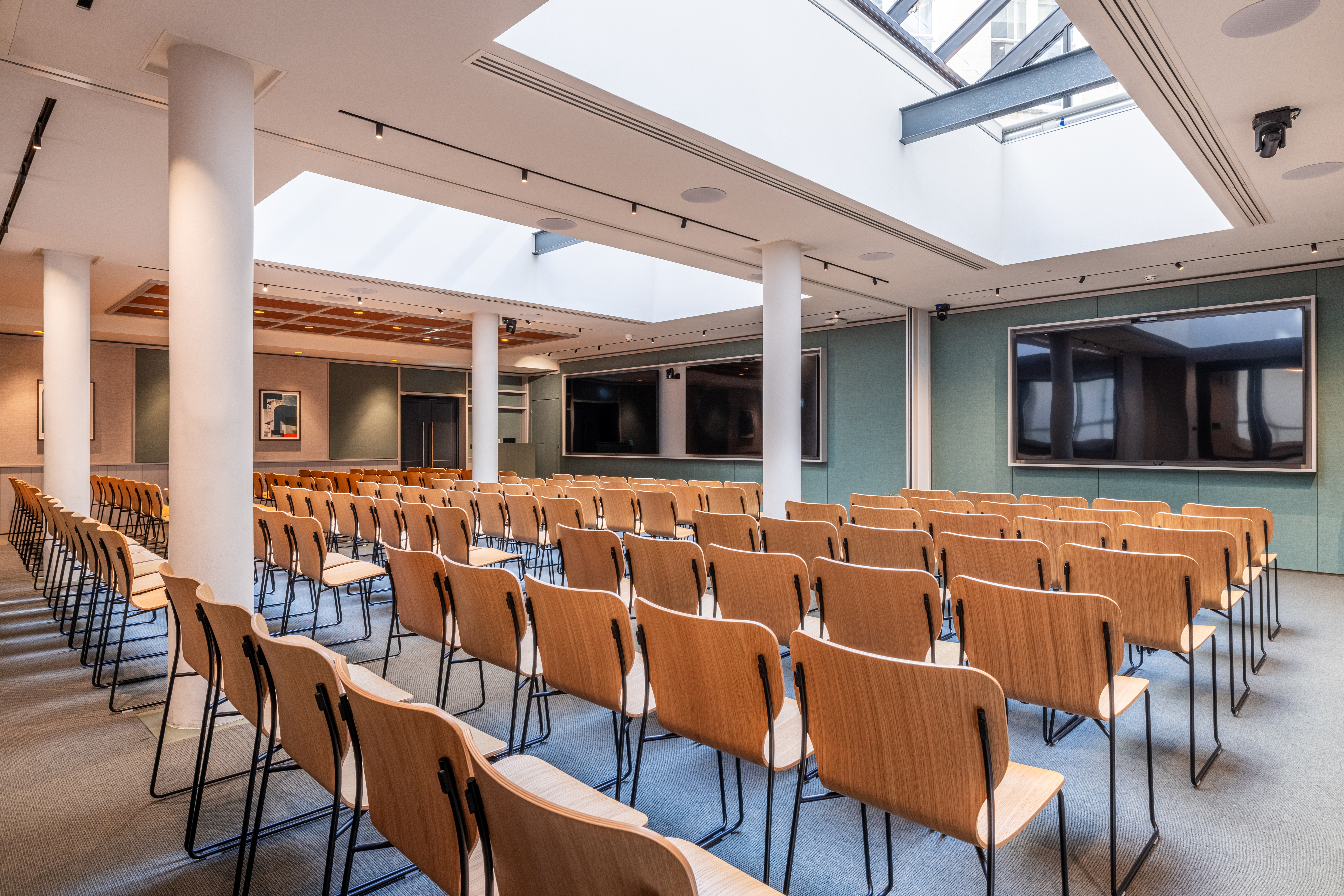 Versatile event space at Salisbury House with modern chairs for seminars and presentations.