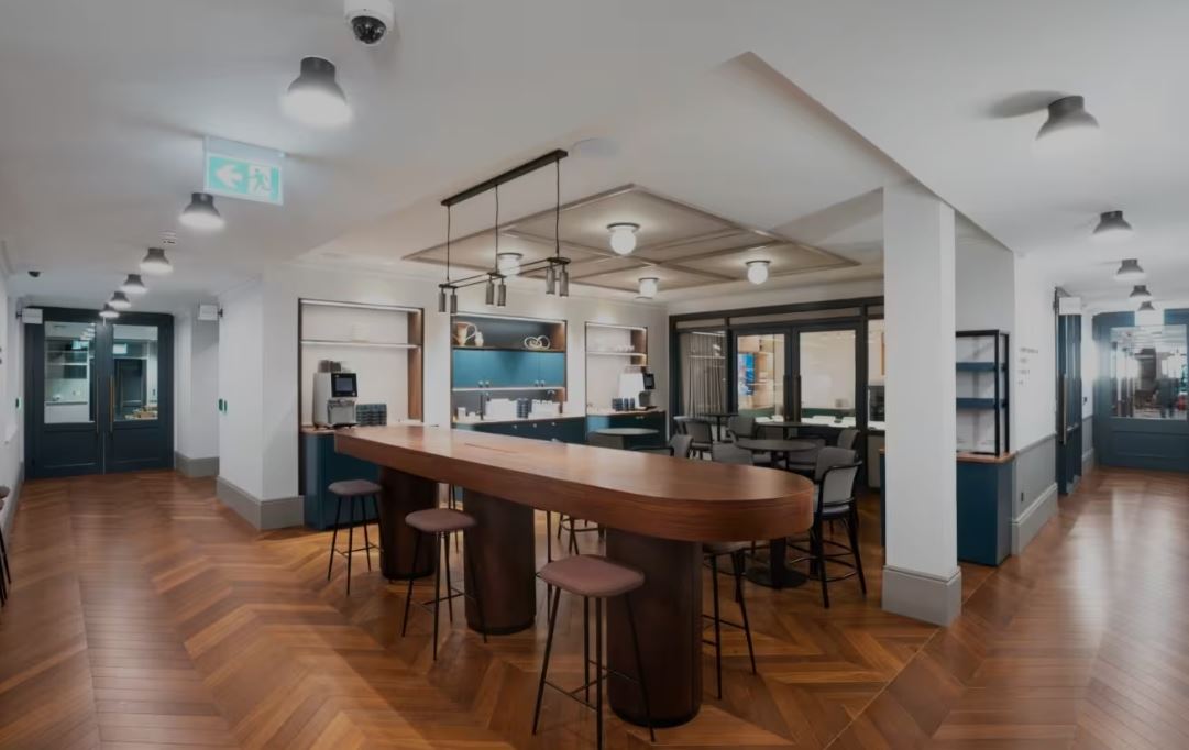 Modern reception area with wooden bar at Salisbury House for events and meetings.