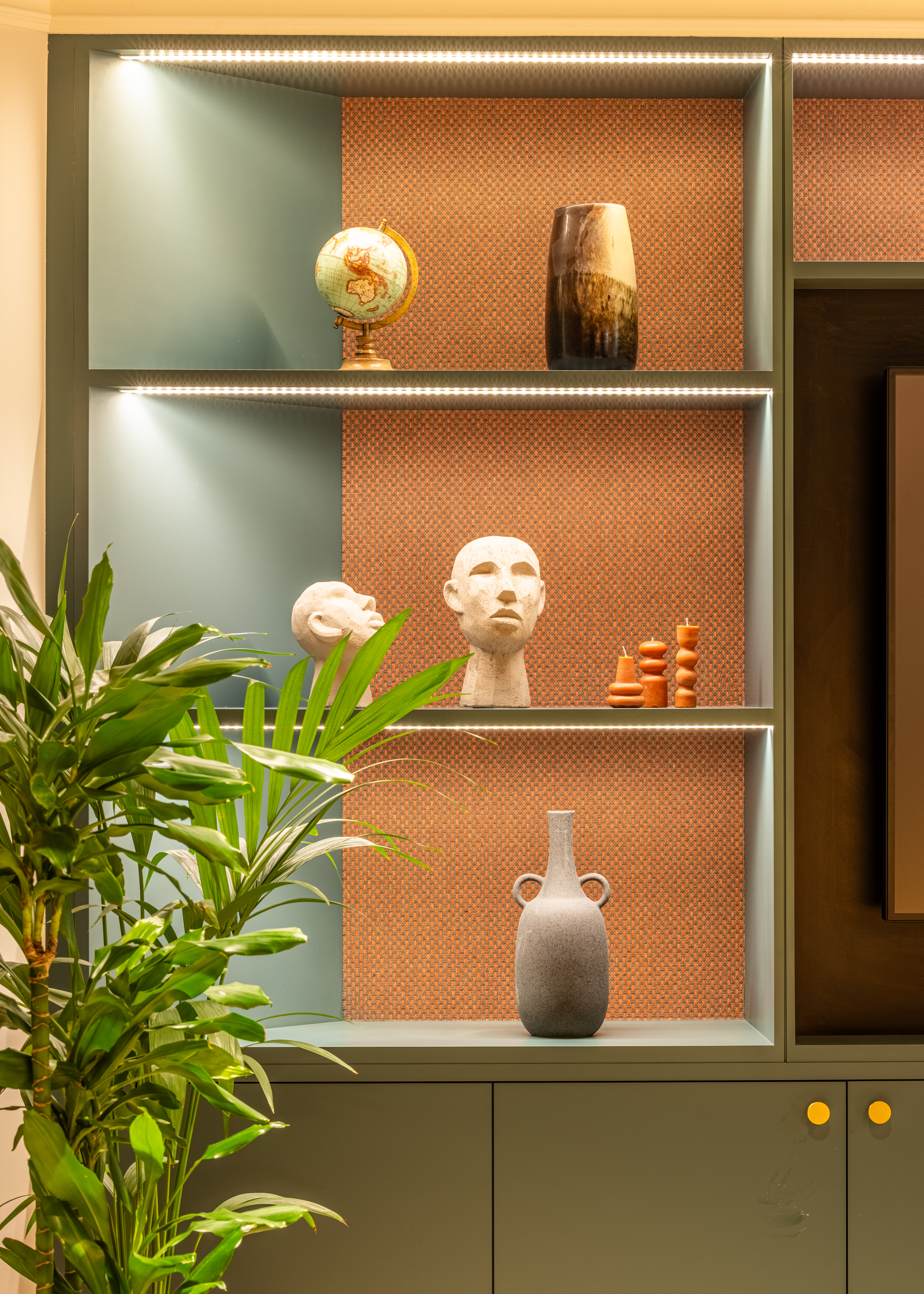 Stylish display shelf with art and greenery in Salisbury House event space for meetings.