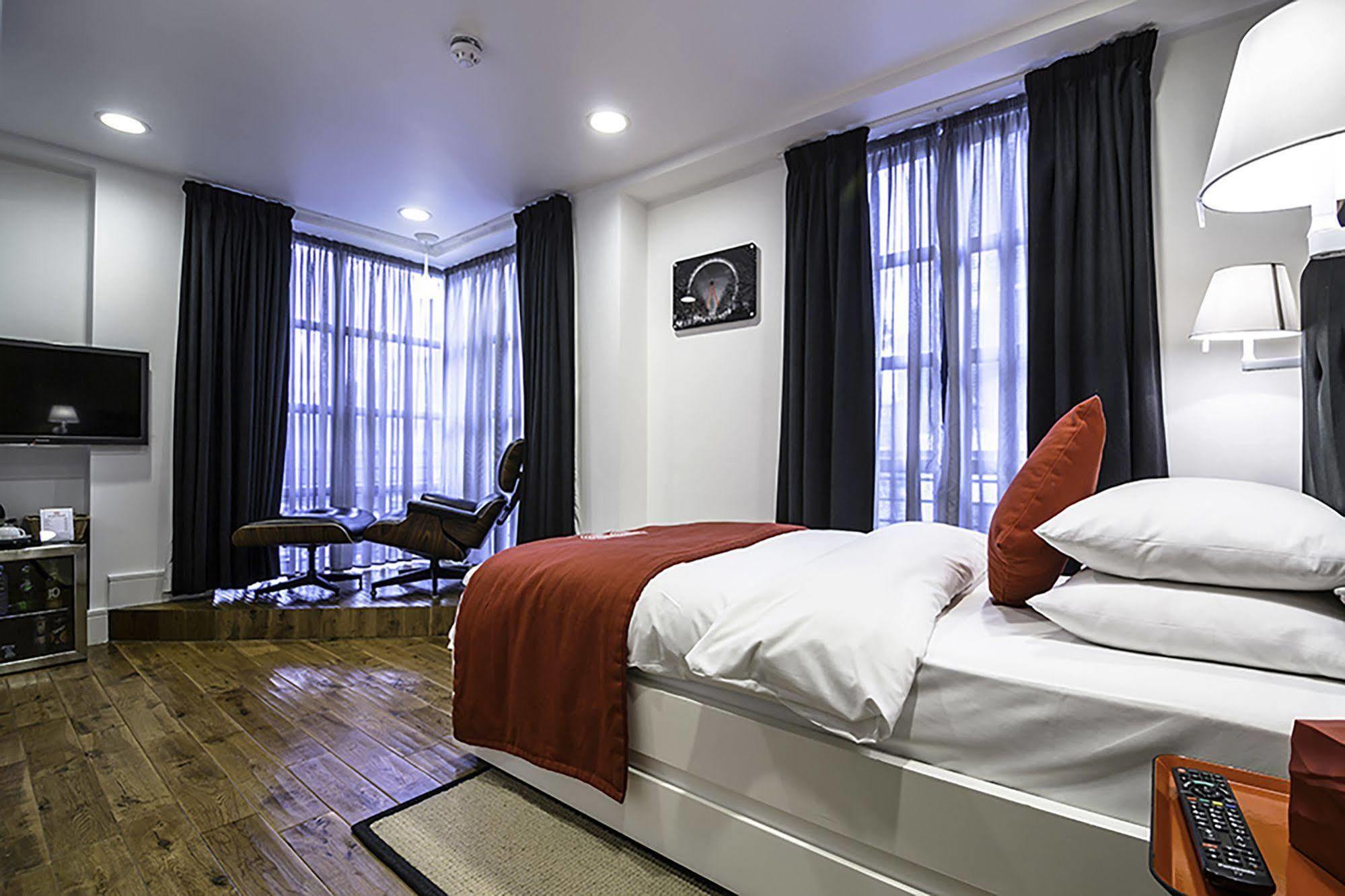 Well-appointed hotel room with modern decor for small meetings at The Whitechapel Hotel.