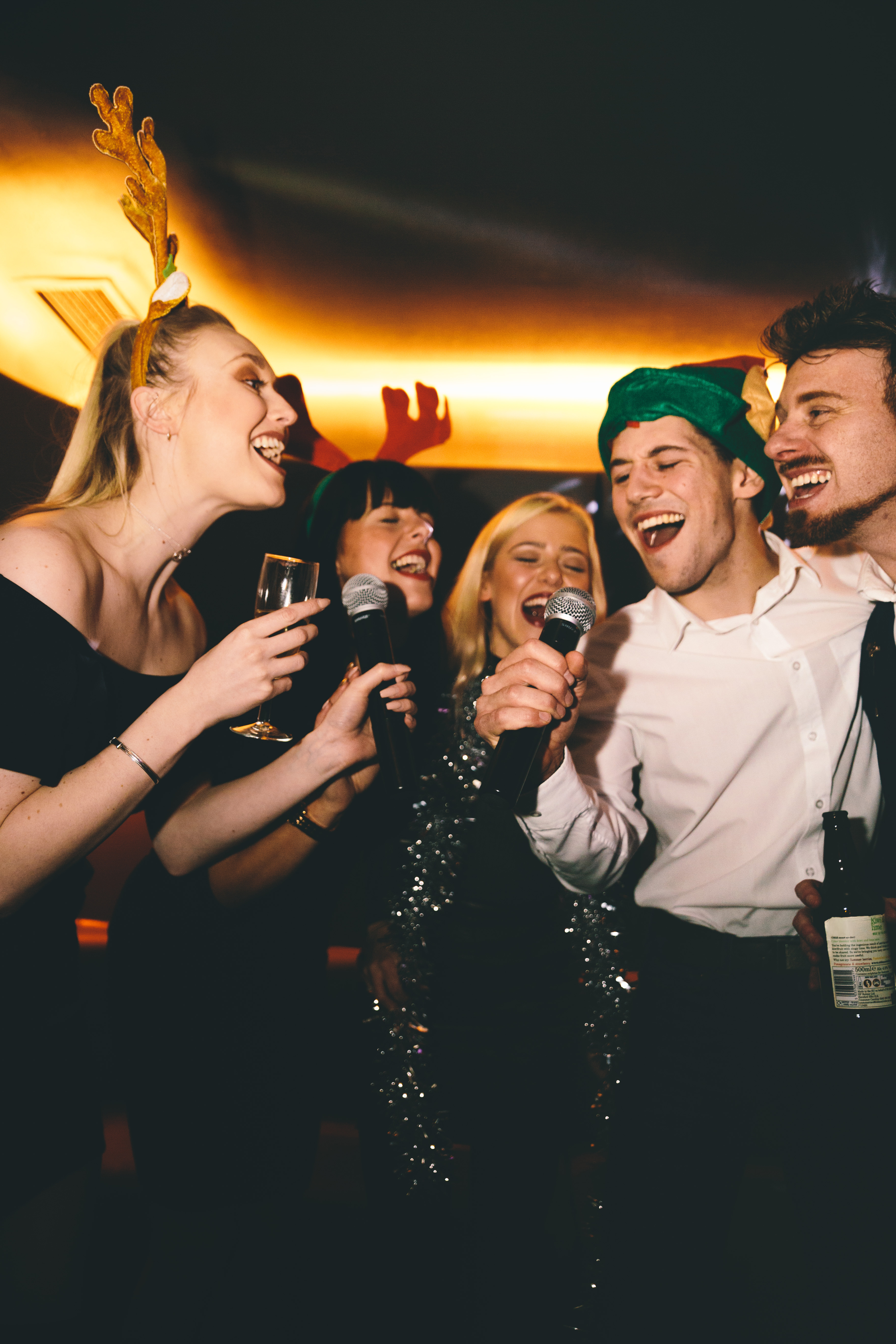 Lively Christmas party karaoke at Lucky Voice Liverpool Street, showcasing festive fun.