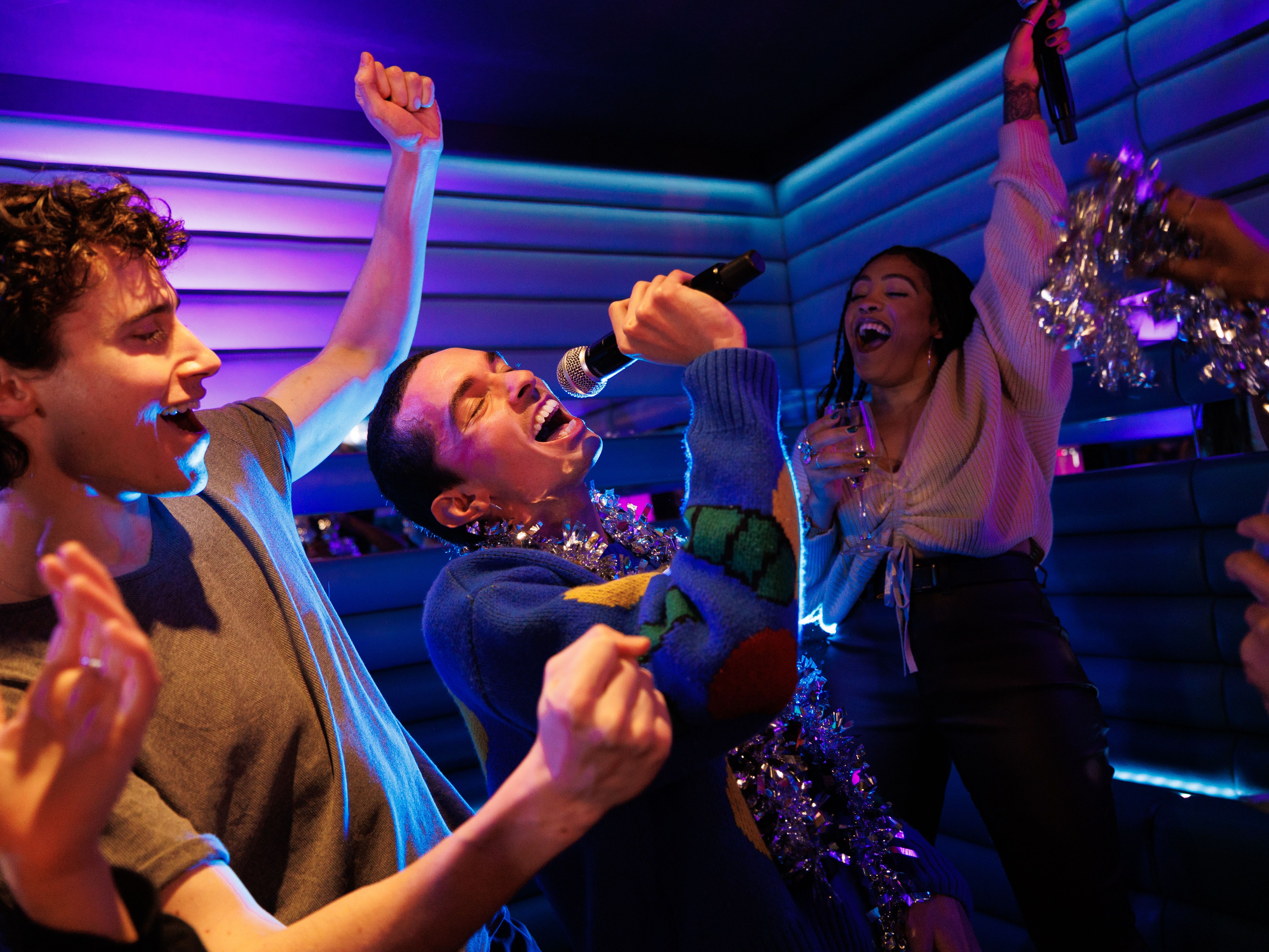 Christmas party karaoke at Lucky Voice Holborn, vibrant atmosphere for team-building fun.