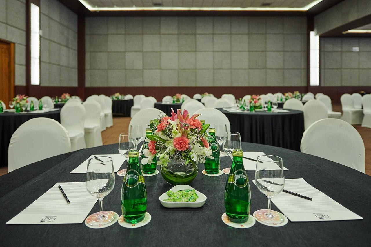 Elegant meeting space with floral centerpieces, ideal for corporate events in Bangalore.