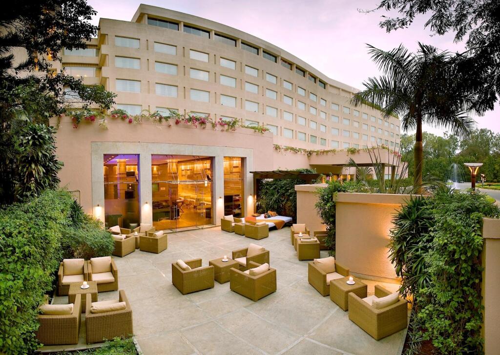 Elegant hotel exterior at Kalinga, LaLiT Ashok Bangalore; perfect for events and gatherings.