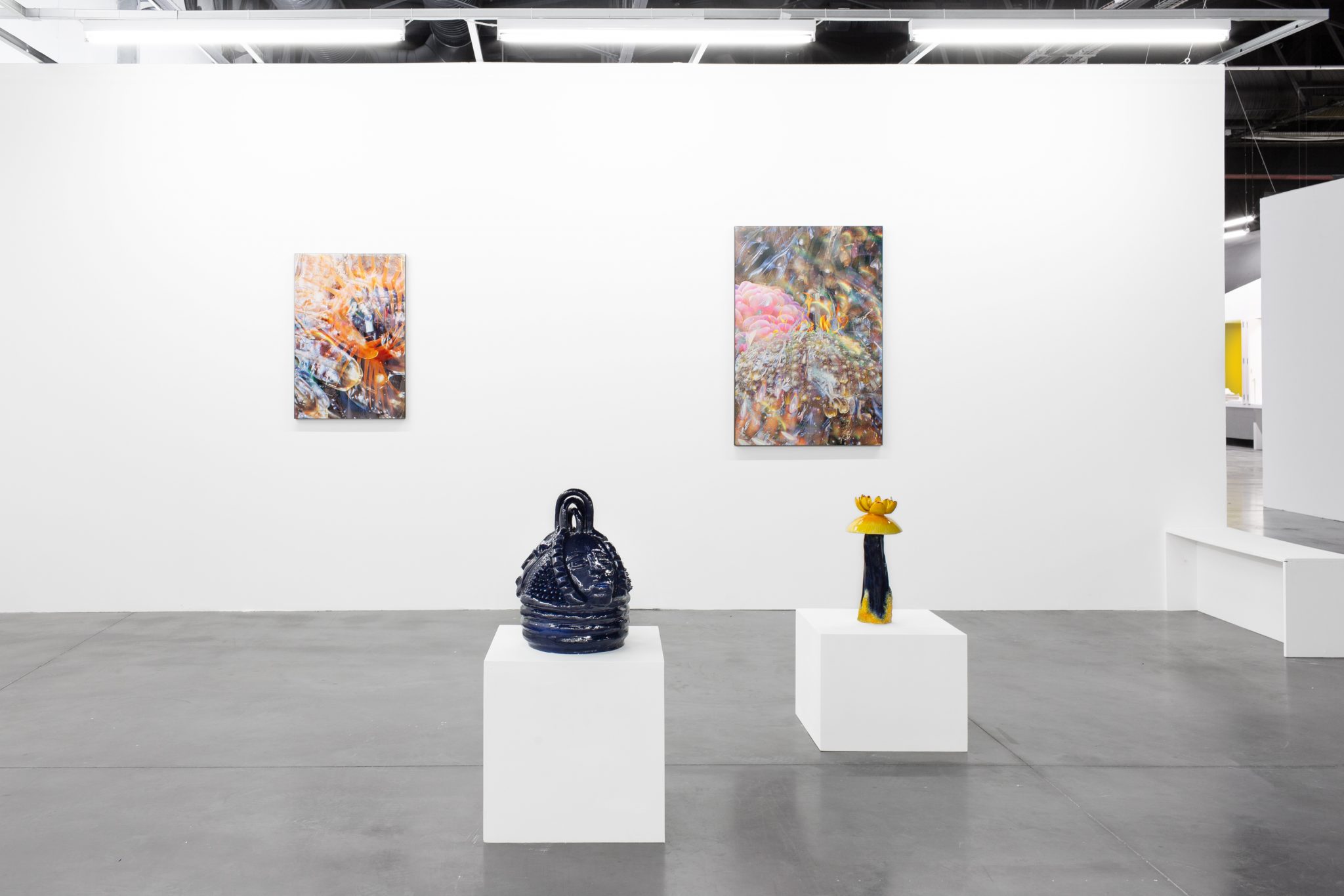 Modern art gallery with white pedestals for upscale events and exhibitions.