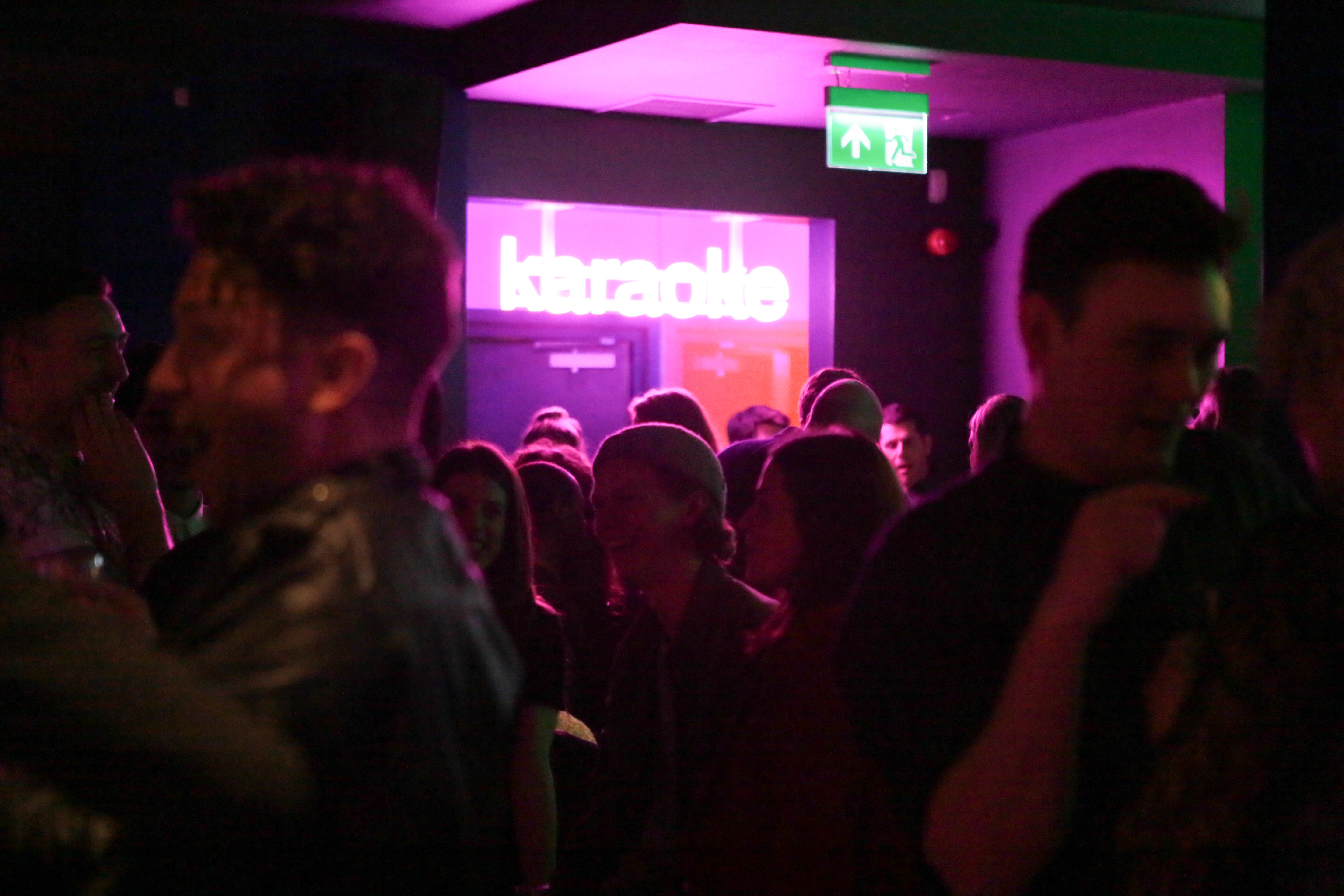 Vibrant karaoke event at Lucky Voice Islington with colorful lighting and lively atmosphere.