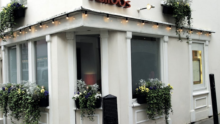 Salloos Bar Reception exterior with welcoming lighting, ideal for intimate gatherings.