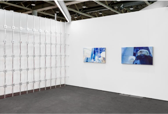 Minimalist exhibition space in Shoreditch with textured wall installation for events.