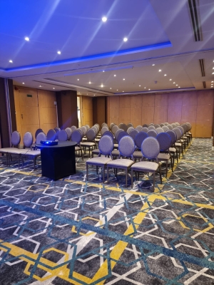 Meeting room at Courthouse Hotel with projector, ideal for seminars and presentations.