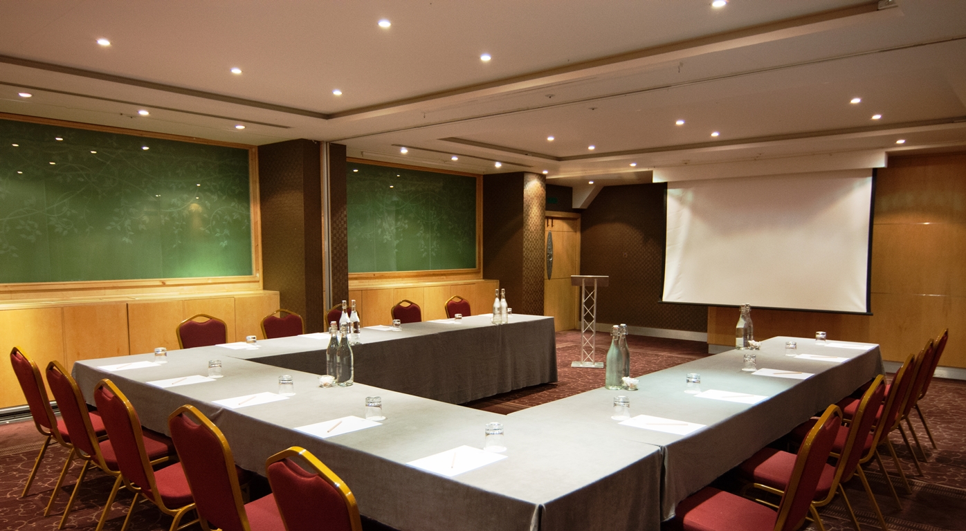 Meeting room at Courthouse Hotel with U-shaped tables for professional gatherings.