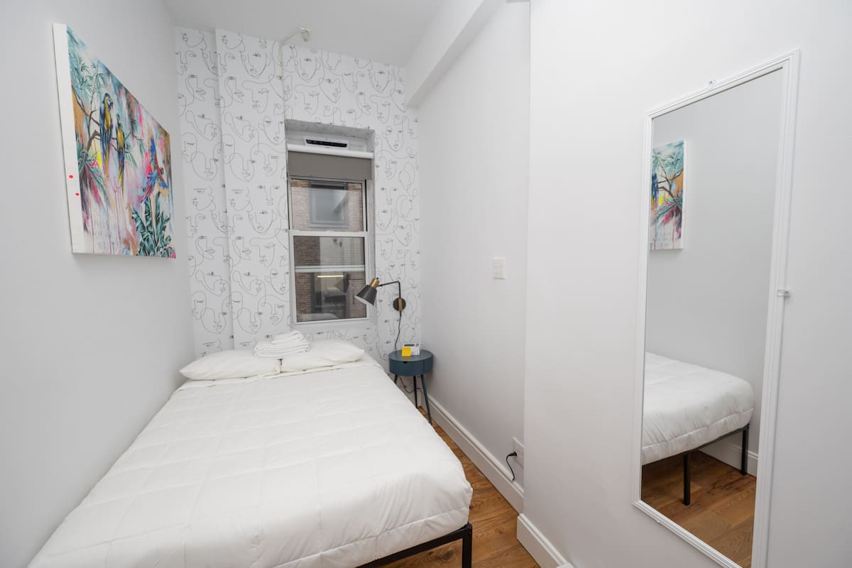 Minimalist hotel room in The Flat NYC, ideal for intimate meetings and retreats.