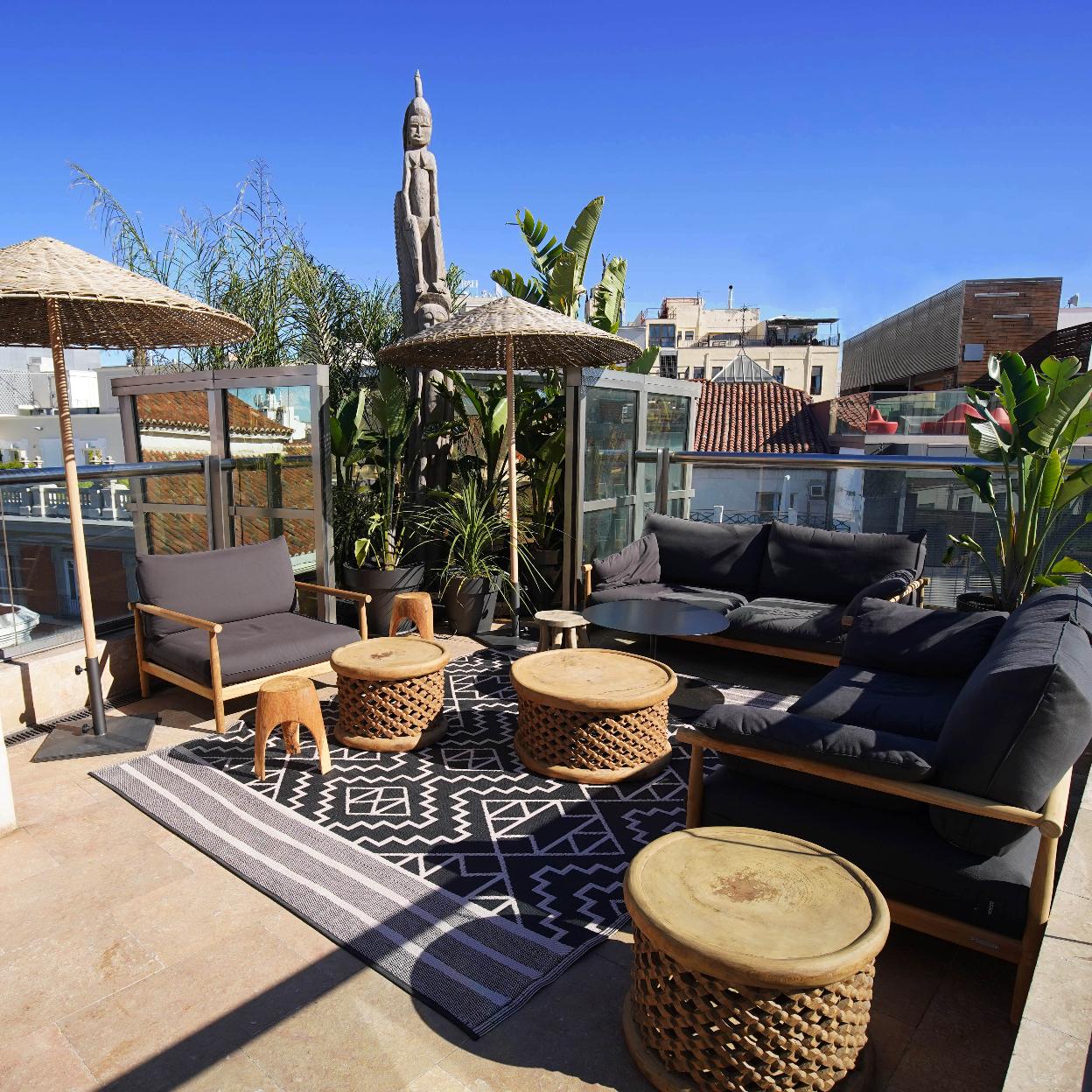 Stylish outdoor lounge at Hotel Urban's Urban Terrace for networking events and meetings.
