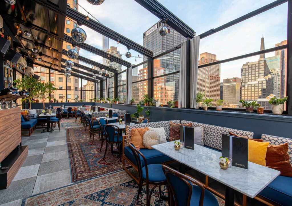 Chic rooftop bar at CIVILIAN Hotel with city views for corporate events and gatherings.