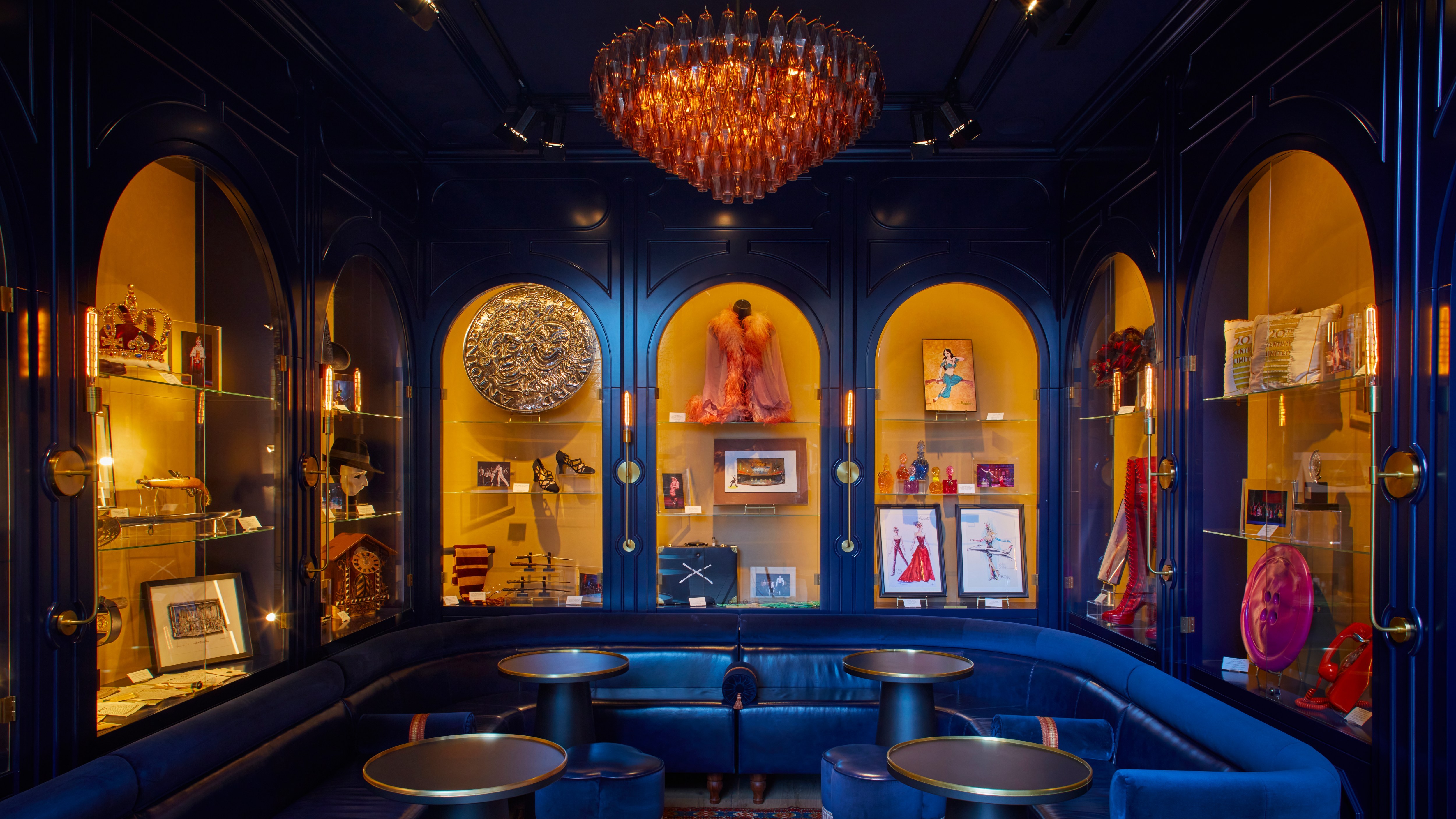 Elegant CIVILIAN Hotel bar with rich blue tones, perfect for intimate gatherings.