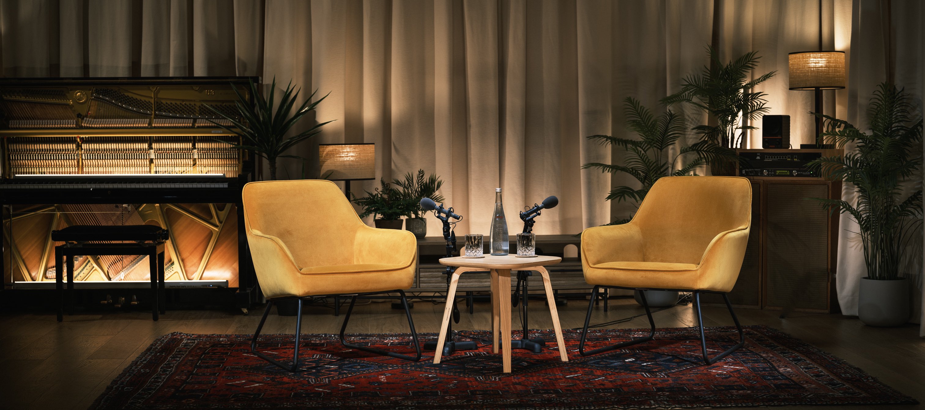 "Jefferson Live Room with inviting yellow chairs for panel discussion or interview."