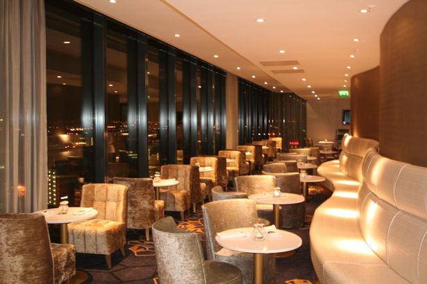 Modern event space with panoramic windows at Cloud23, ideal for gatherings and networking.
