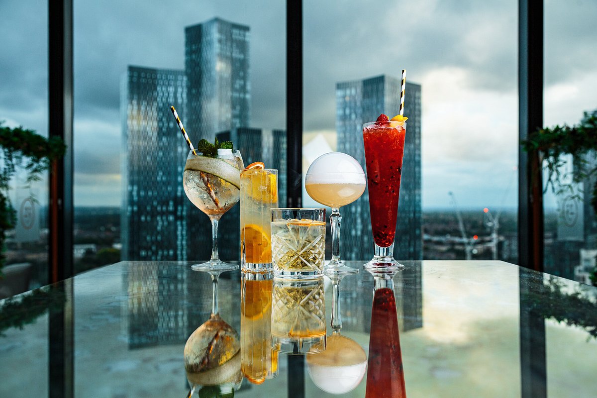 Stylish cocktail display at Cloud23 with urban skyline, perfect for networking events.