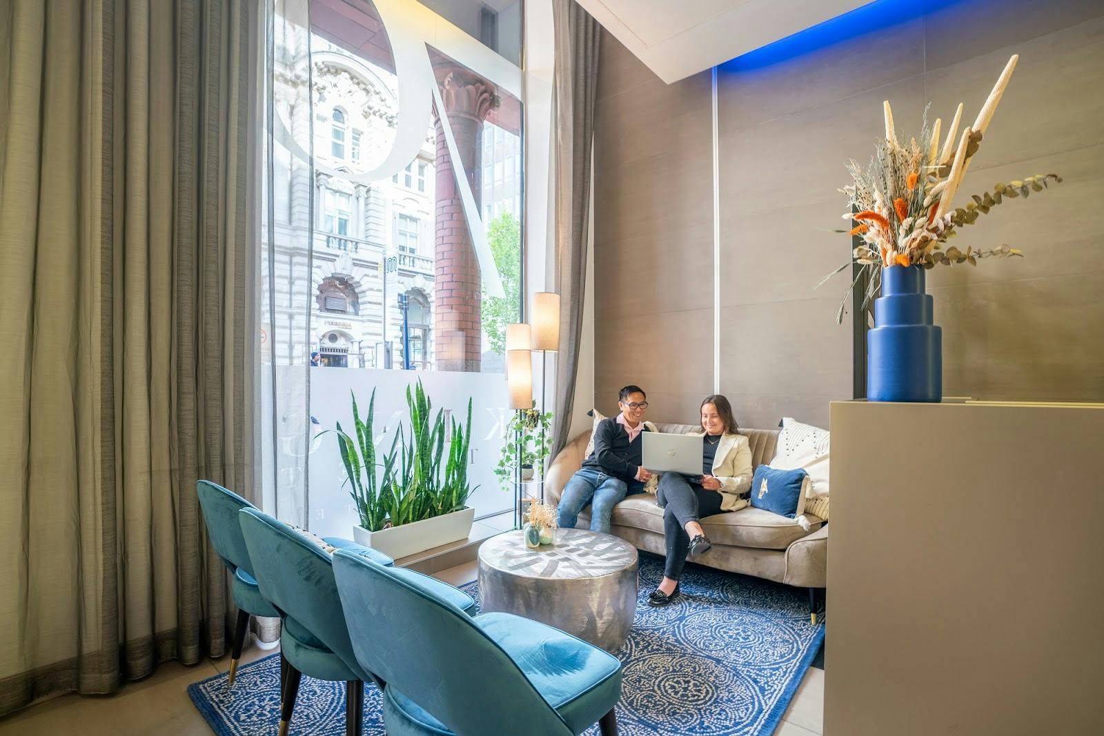 Modern meeting room in Orega King Street, featuring soft seating and natural light for events.