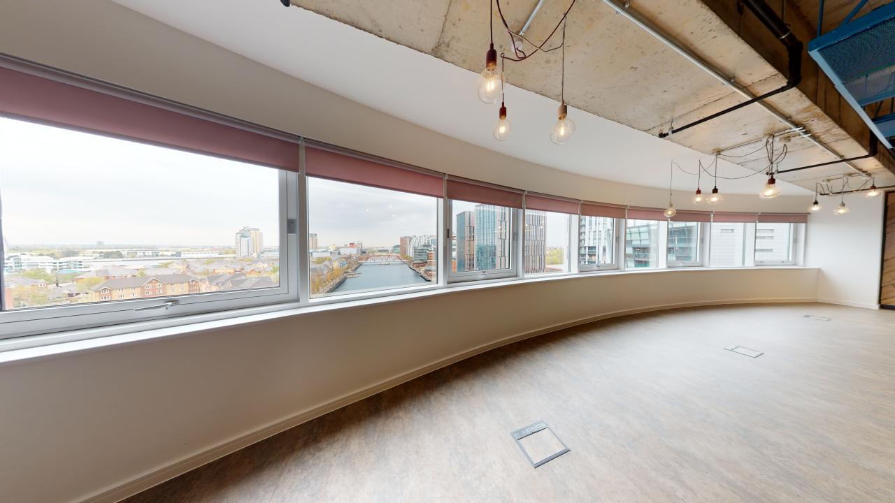 Modern meeting room in Anchorage with panoramic windows, perfect for team sessions and events.