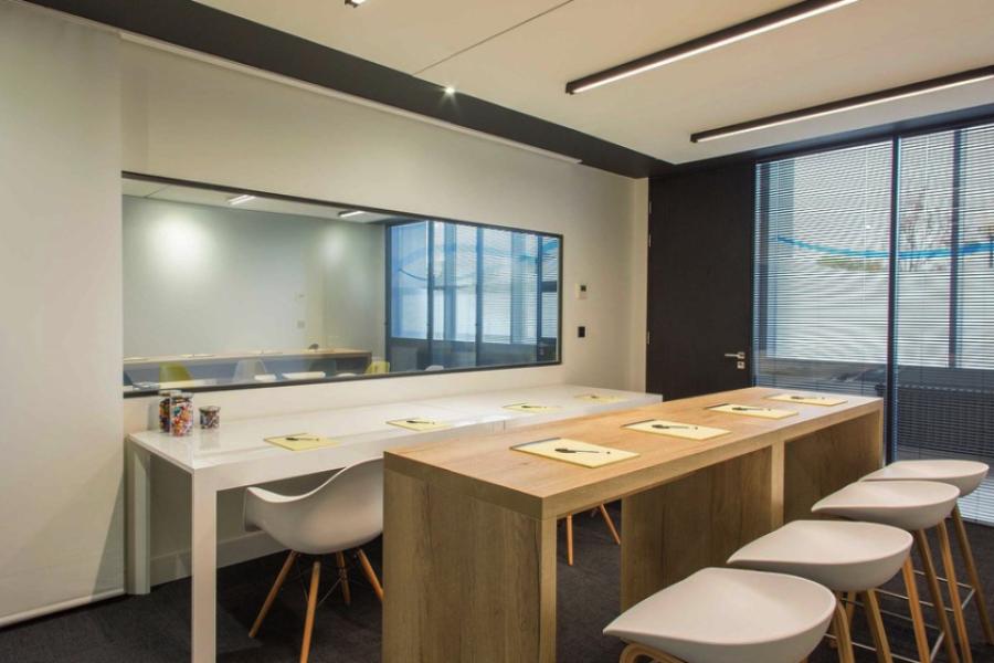 Modern meeting space in Anchorage with natural light, ideal for collaboration events.