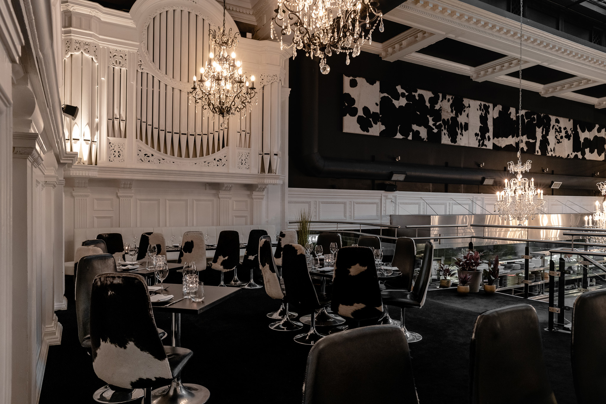 Stylish event space with chandeliers, perfect for upscale dining and receptions.