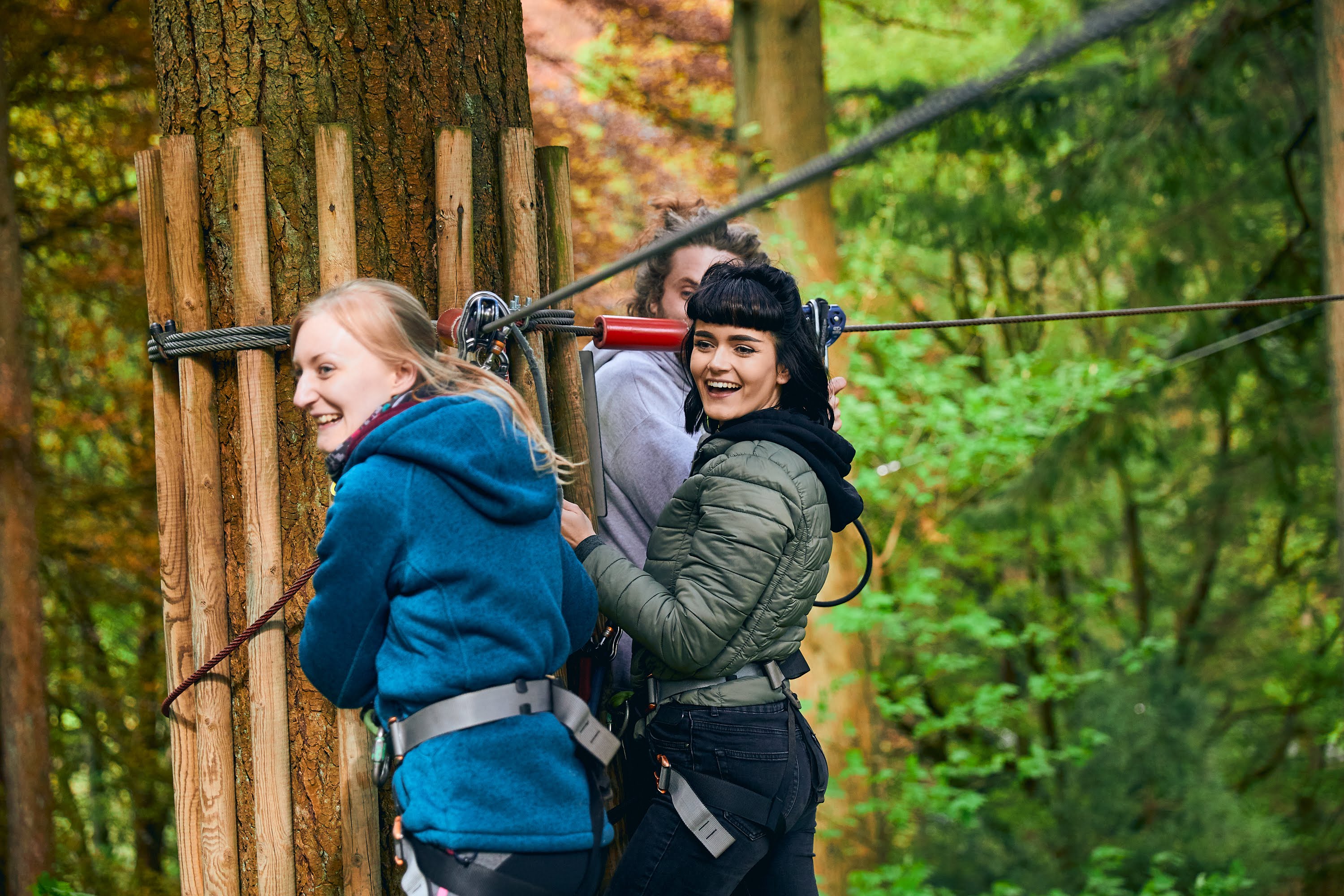 Axe throwing team-building activity in lush Go Ape Rivington, perfect for corporate retreats.