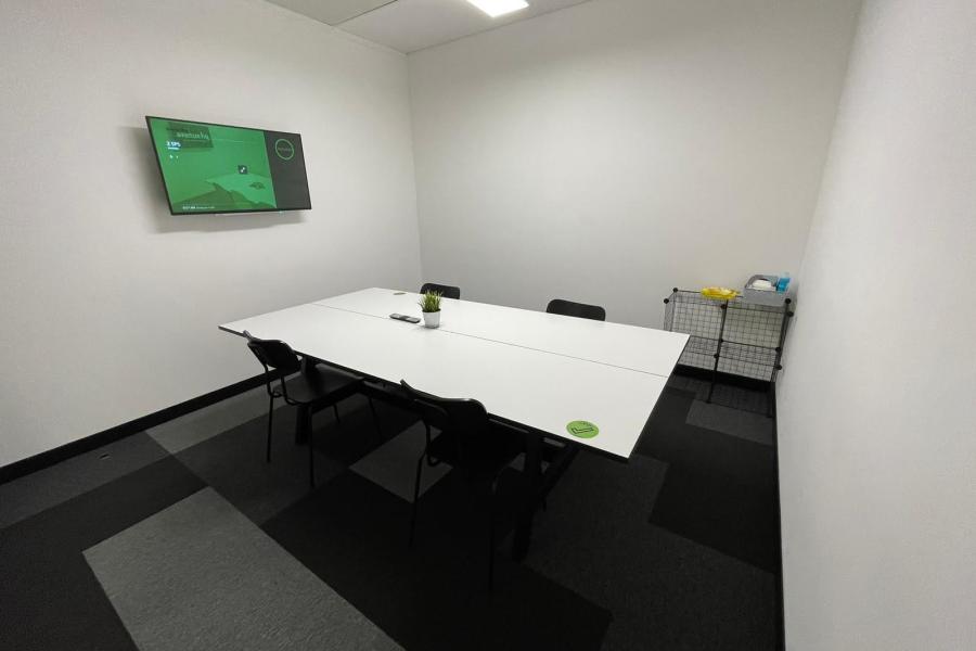 Sleek meeting room with table and chairs for professional discussions at Portal Business Centre
