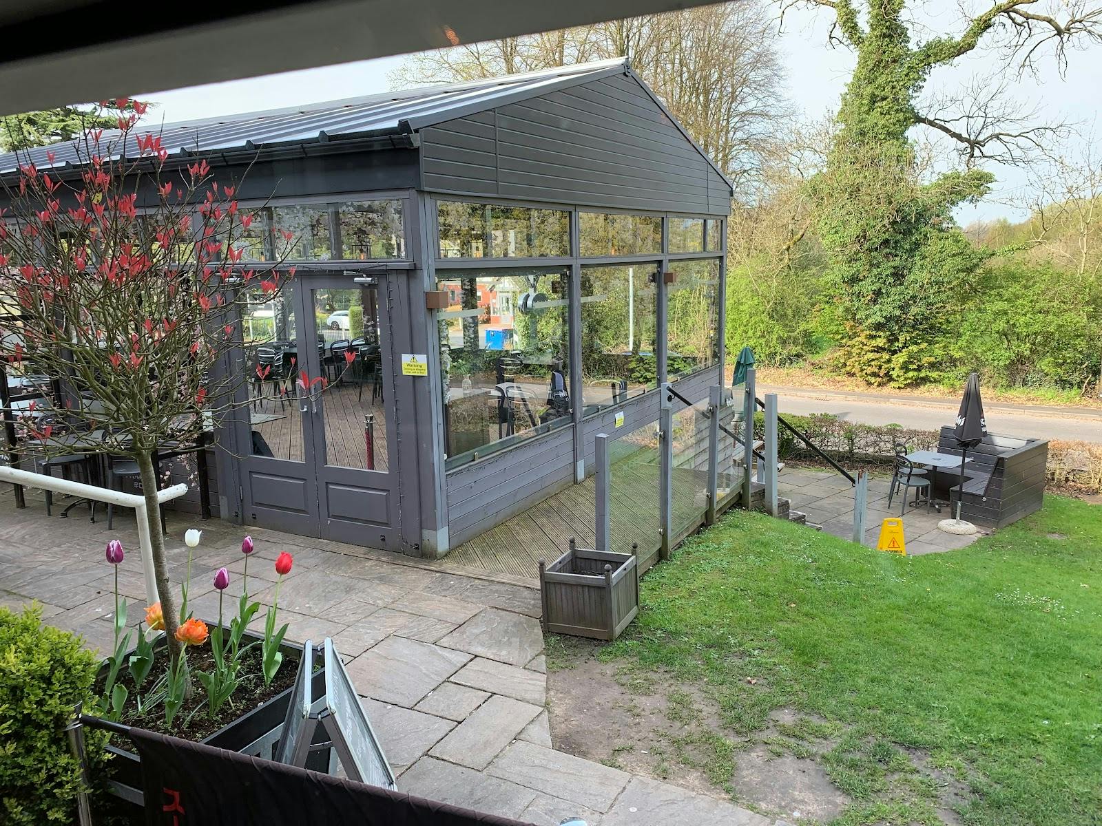 Stylish event space with glass enclosure, perfect for corporate and social gatherings.
