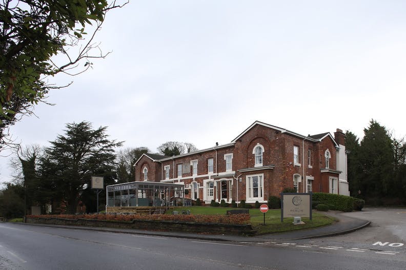 Private dining venue with classic brick facade, ideal for corporate retreats and events.