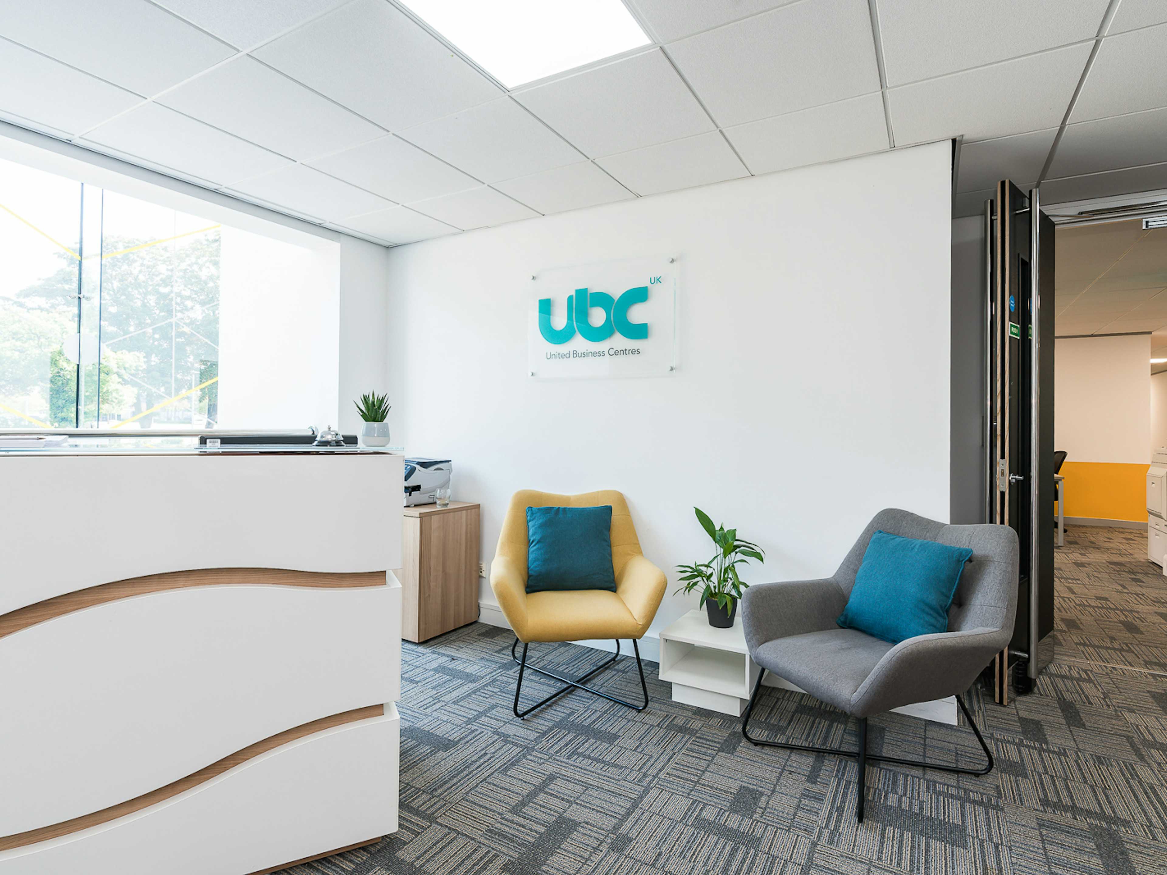 Modern office reception at UBC flexible offices with stylish seating for events.