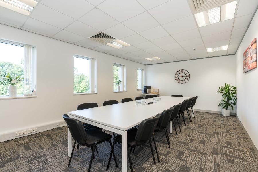 Modern Board Room at Bridge School with conference table, ideal for meetings and workshops.