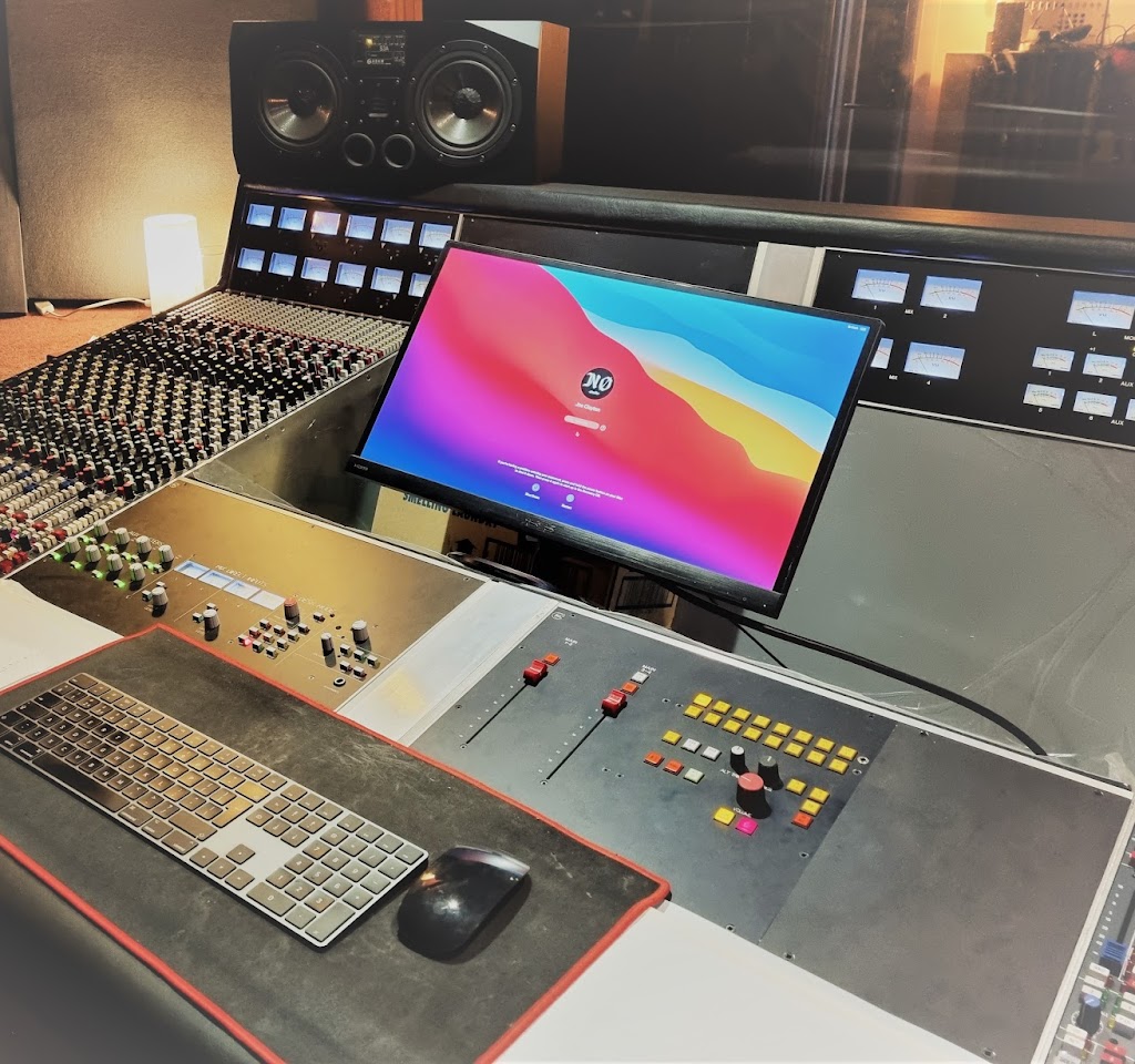 Professional recording studio with advanced mixing console for live events and seamless presentations.