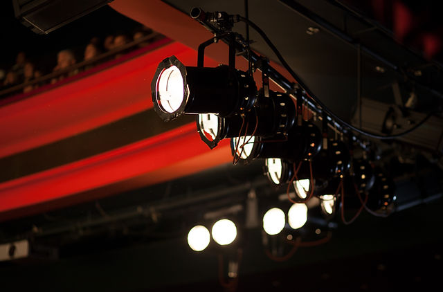 Dance studio with theatrical lighting, perfect for performances and events.