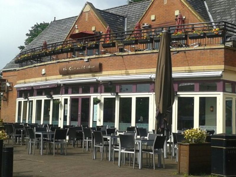 Outdoor event space at Slug and Lettuce Didsbury with modern furniture and greenery.