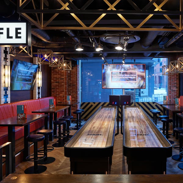 Vibrant BOX Deansgate venue with rustic decor, ideal for team-building and gatherings.